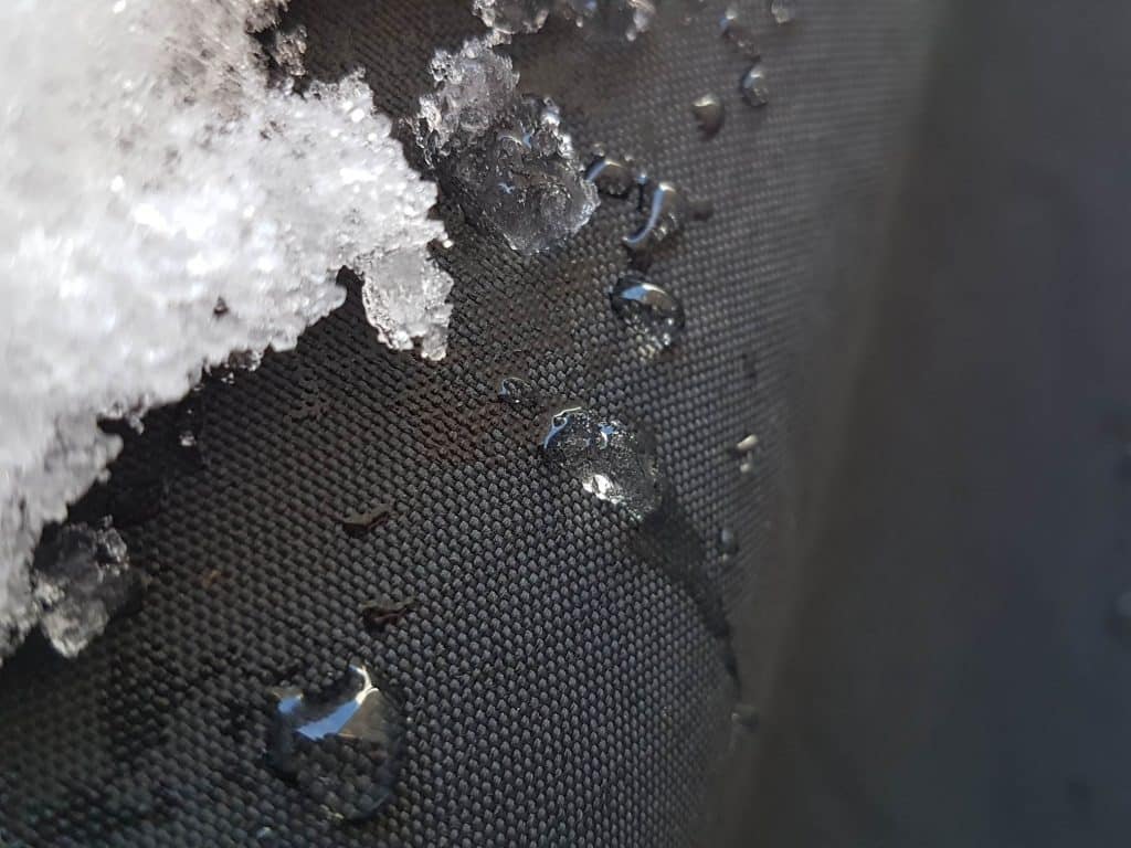 Winterized motorcycle tarpaulin with snow and water